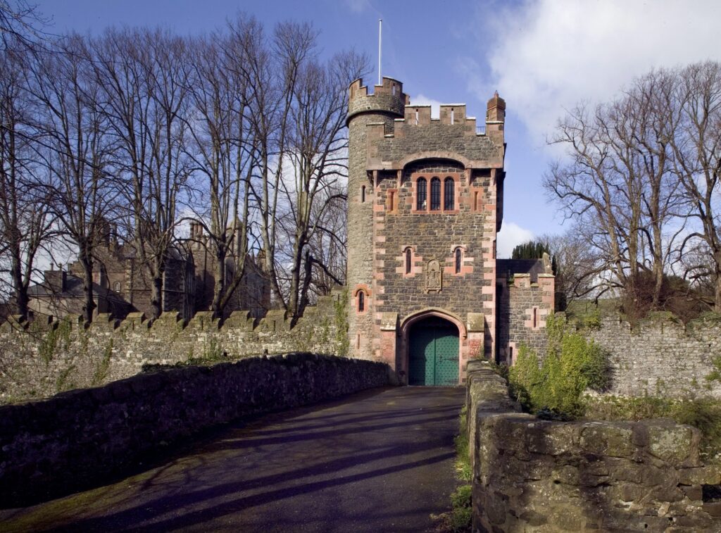 The stone towers and battlements of the Barbican Gatelodge at Glenarm